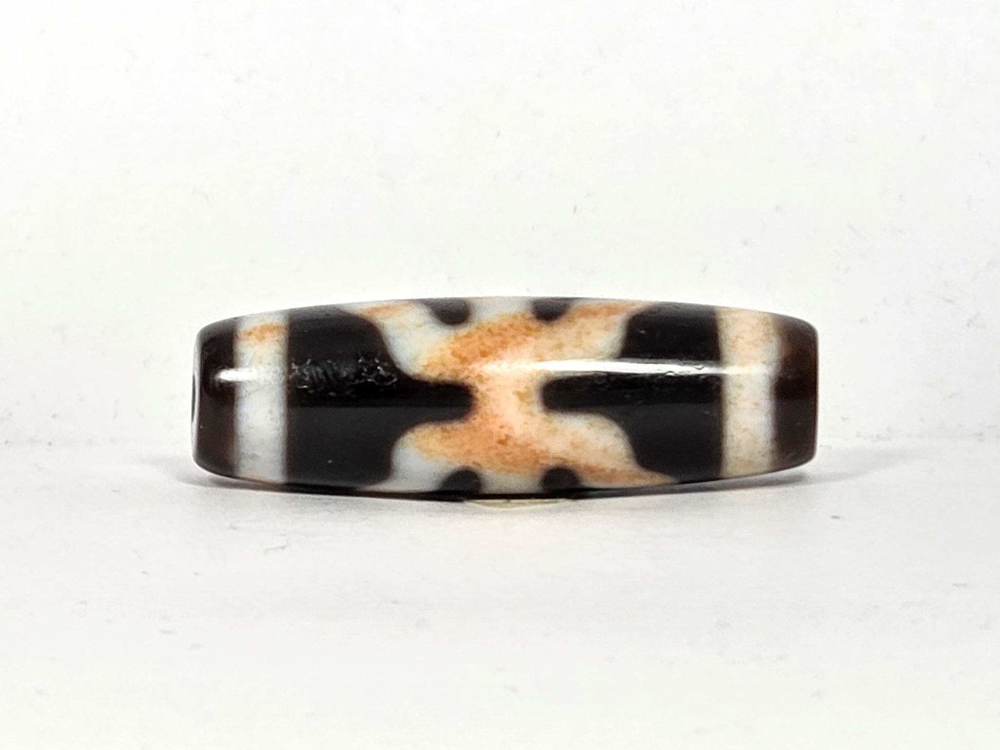 V-021326-BenBS vintage Benefactor dzi bead, second face rotated 90°, cream interlocking grid visible, unretouched.