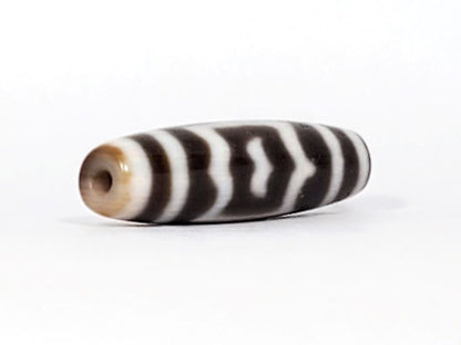V-091424-GarudaBS Garuda dzi bead, opposite end view, honey-tan cap, very deep dark brown body, unretouched