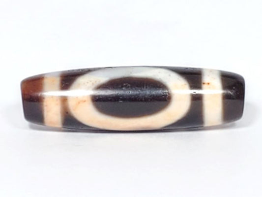 V-082123-HEBS Heaven & Earth dzi bead, fourth face angle, warm ivory cream zones against dark brown ground, unretouched