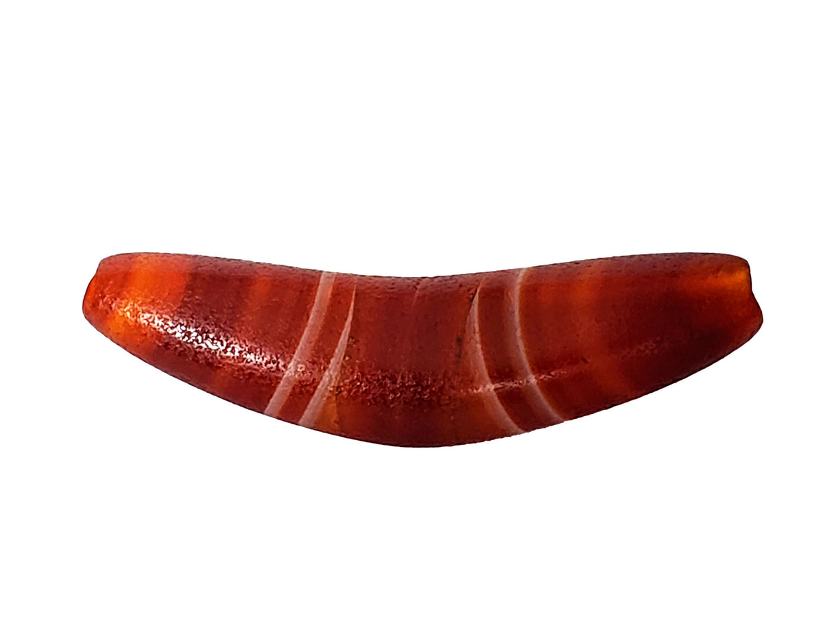 Bow-shaped natural banded agate dzi bead with reddish-orange bands and smooth polished surface
