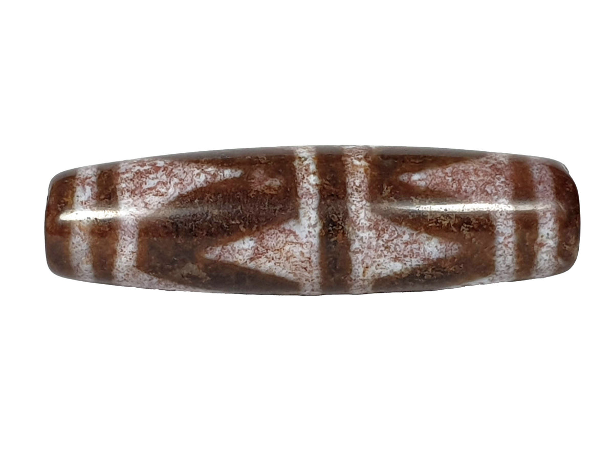 Double wave tiger tooth dzi bead, warm brown agate, white etched motif, aged patina, elongated barrel shape, 54.6mm