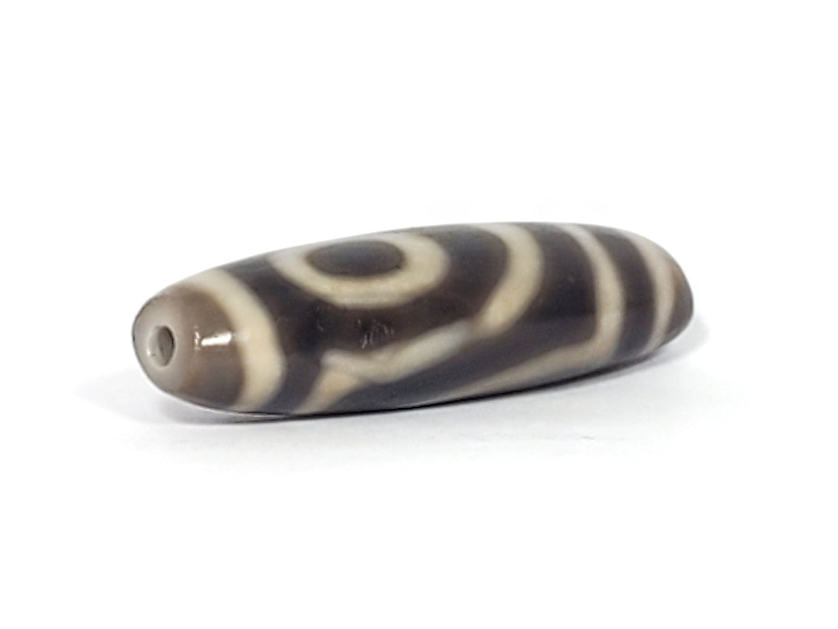 Ac-071026-TWE3 ancient two eye dzi angled view drill end A oval cross-section profile small hole unretouched