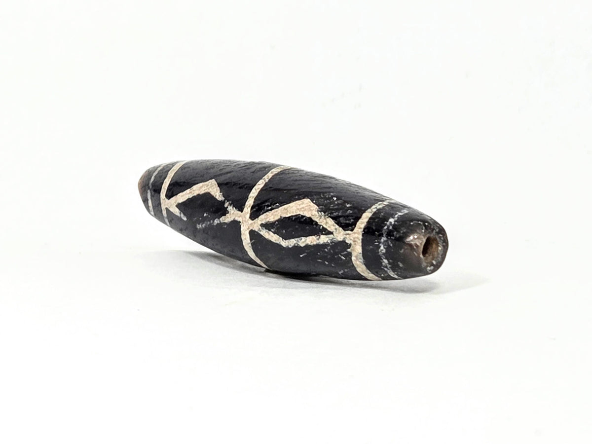 Ac-062426-3DS ancient three diamond spear agate dzi 49.1x12.2mm angled gradual end drill hole warm brown-black unretouched