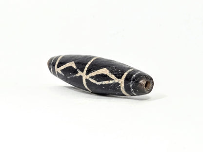 Ac-062426-3DS ancient three diamond spear agate dzi 49.1x12.2mm angled gradual end drill hole warm brown-black unretouched