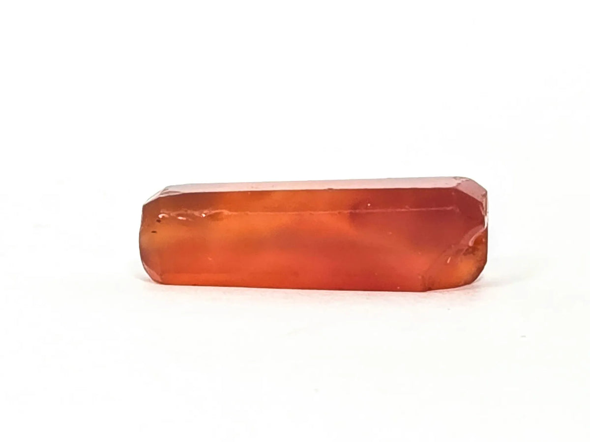 Ancient Indus Valley beveled carnelian bead 28mm translucent orange-red agate with natural banding and chipped edges