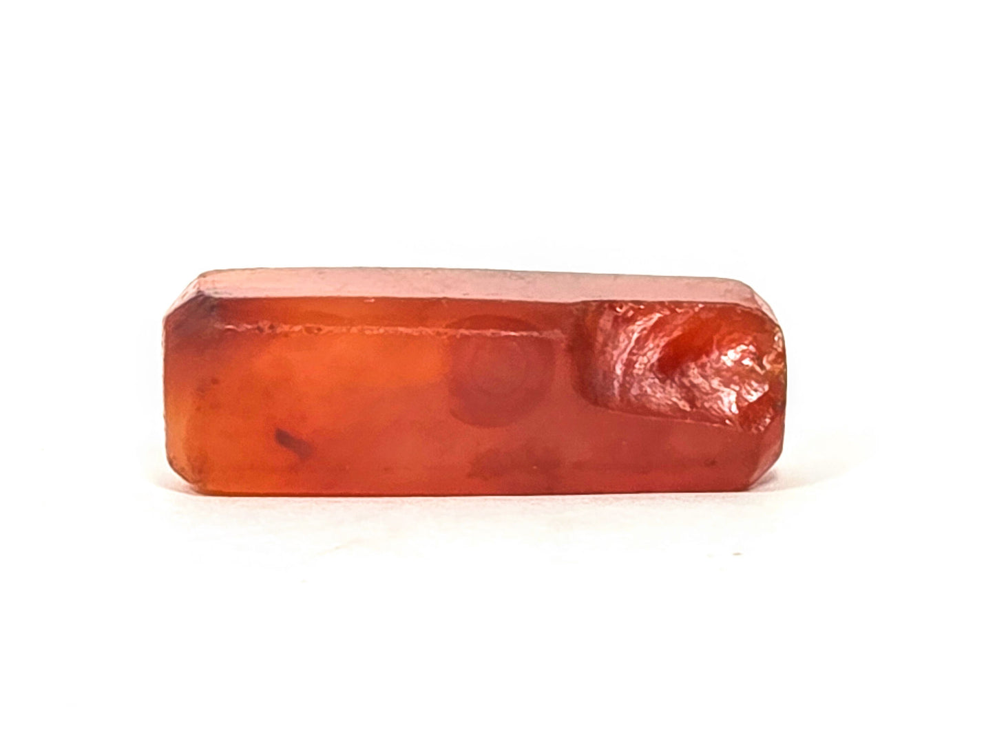 Anc-0626-CBev2, ancient beveled carnelian bead 29.2mm, orange-red translucent, ancient chipping visible at end, unretouched