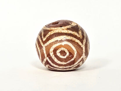Ac-060126-4EHG, Face B closed concentric eye, three rings, chestnut-brown carnelian, crystalline white etching, unretouched