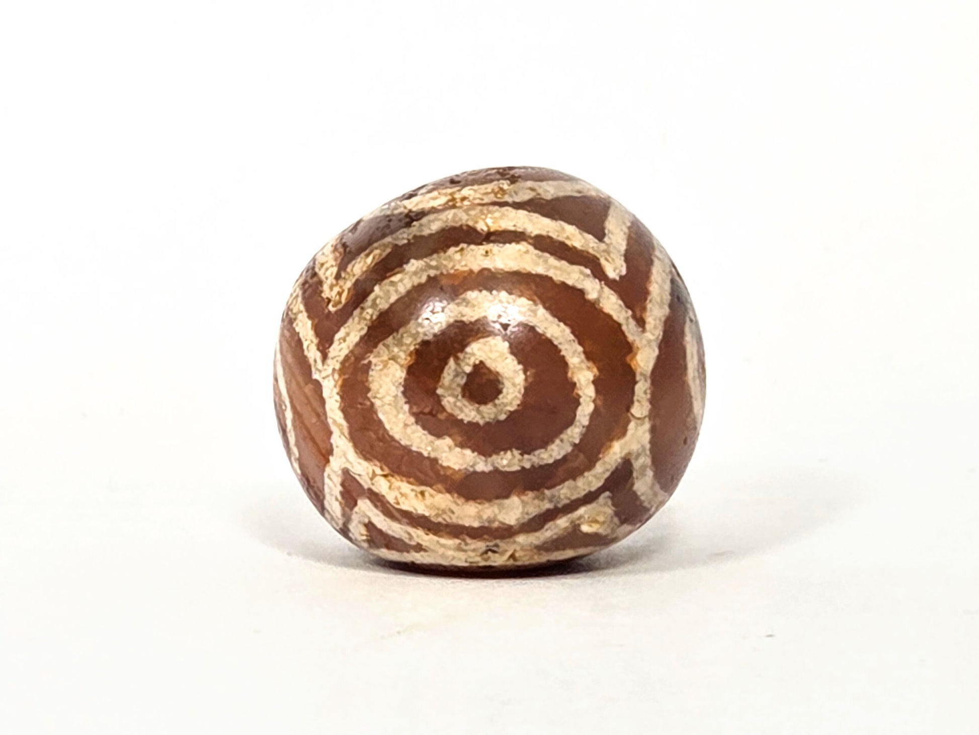 Ac-060126-4EHG, Face C closed eye with Heaven's Gate bracket lines visible, ancient carnelian sphere, unretouched