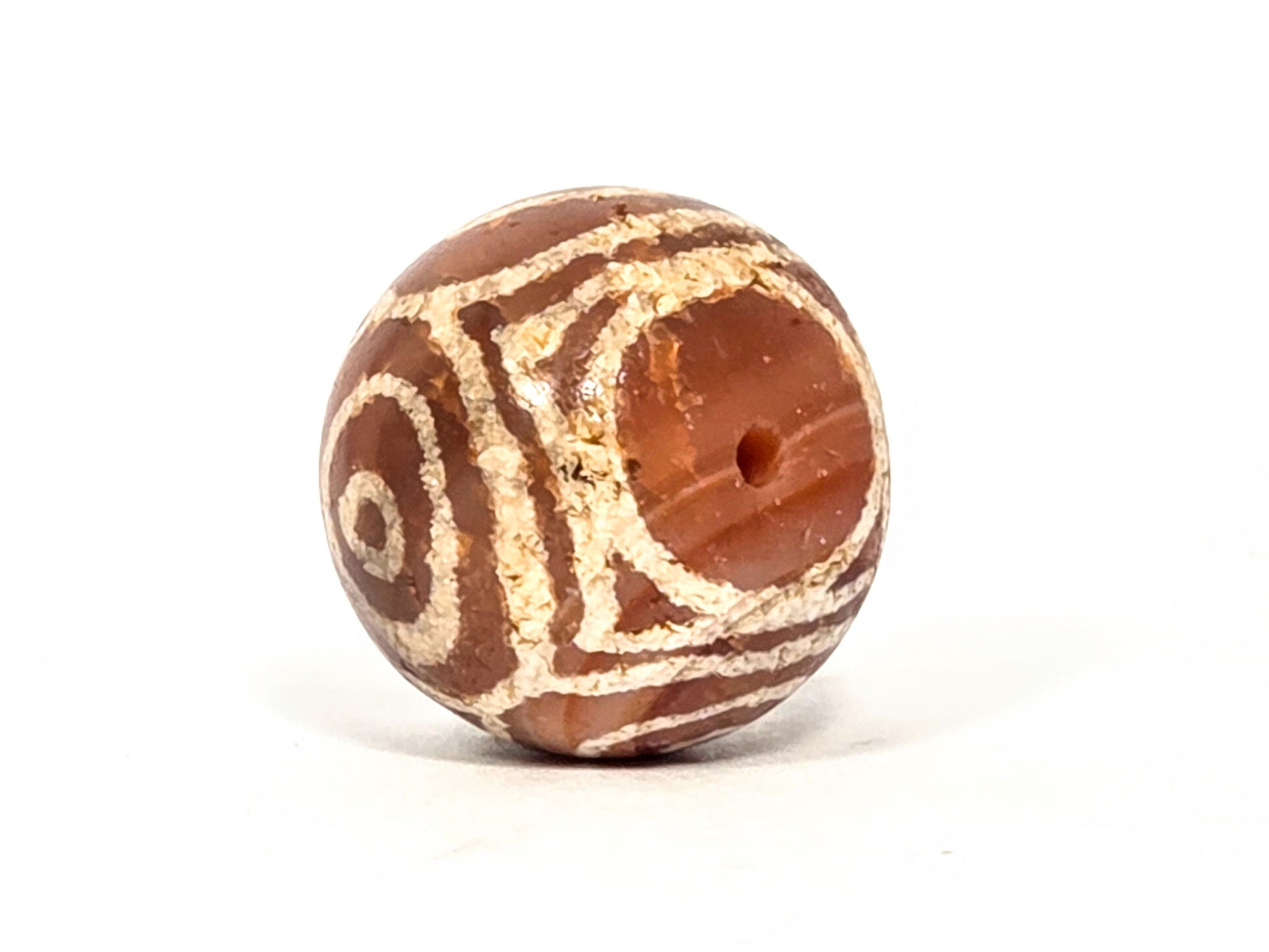 Ac-060126-4EHG, Heaven's Gate bracket motif and drilled pole hole, ancient carnelian four eye dzi sphere, unretouched