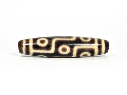 Ac-091626-9E ancient nine eye dzi dark brown agate face A second angle warm cream motif lines aged surface unretouched