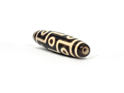 Ac-091626-9E ancient nine eye dzi angled drill end A warm brown end cap small clean hole unretouched