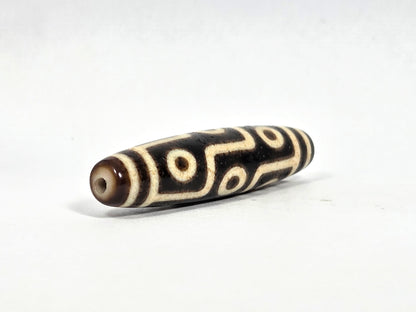 Ac-091626-9E ancient nine eye dzi angled drill end B warm brown end cap small clean hole unretouched