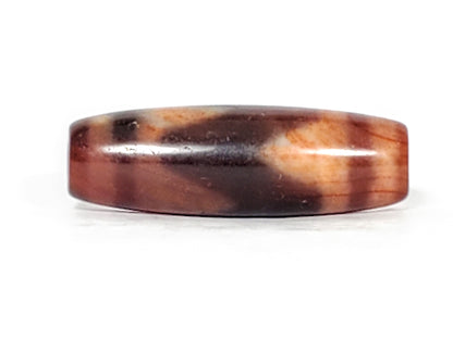 Second face of ancient Tasso Dzi — sweeping cream Tasso lines on mahogany-purple and orange agate