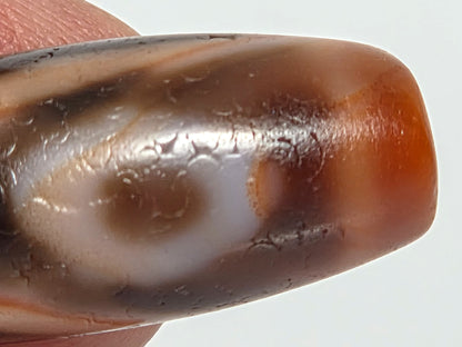 Ac-090326-2E ancient two eye dzi macro close-up naturally formed eye pale iris brown pupil hand-held, unretouched