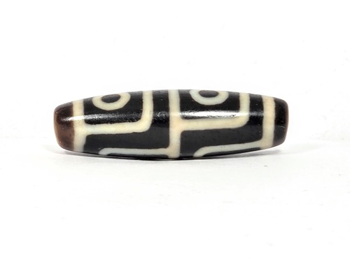 Antique Tibetan dzi bead, four-eye motif, dark brown agate, white etched circles and grid lines, oval barrel shape, aged patina