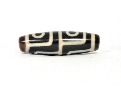 Antique Tibetan dzi bead, four-eye motif, dark brown agate, white etched circles and grid lines, oval barrel shape, aged patina