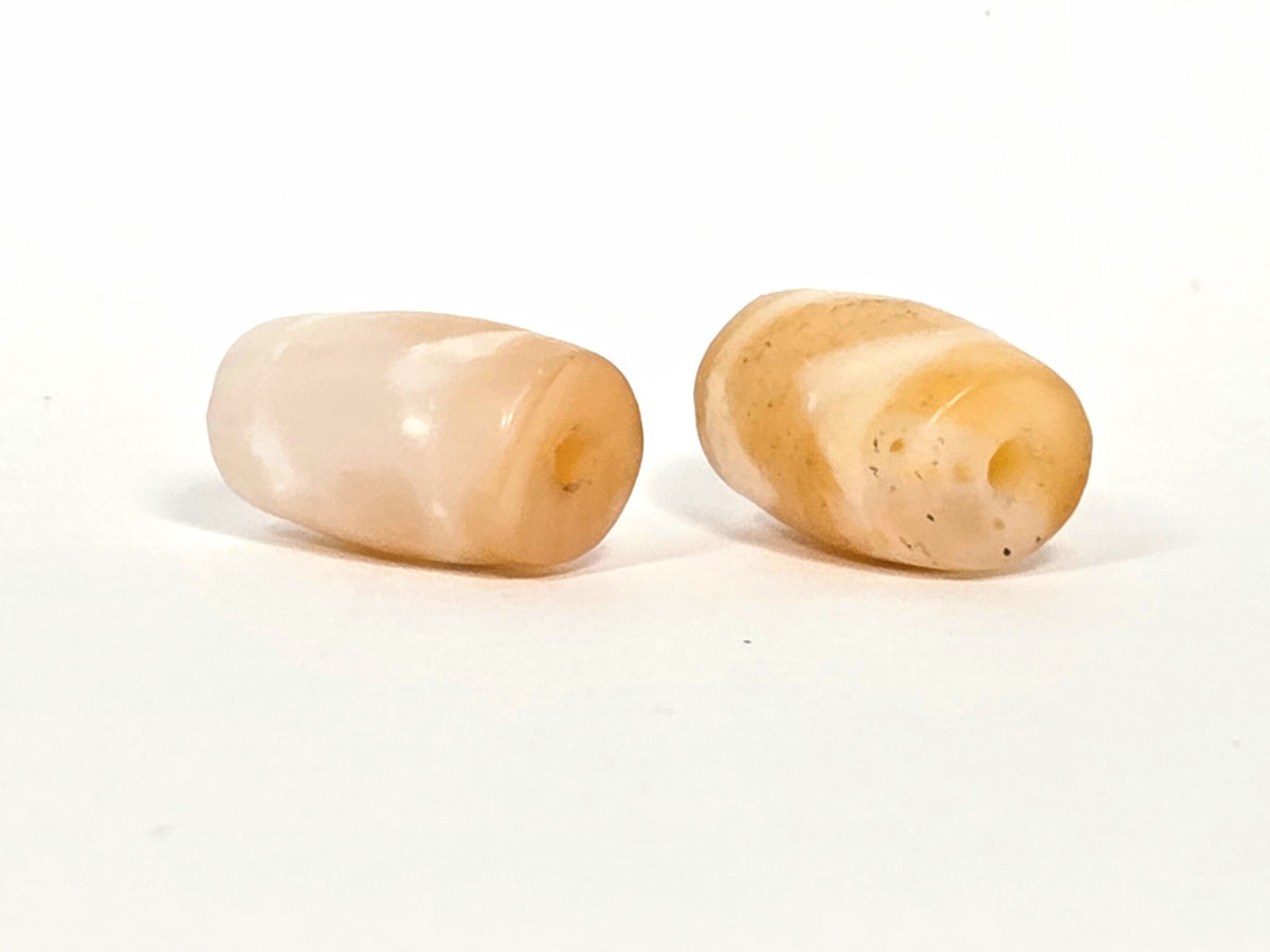 At-073026-WPair antique wave dzi pair top-down view drill holes pale & honey agate contrast unretouched