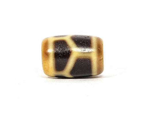 Antique longevity motif dzi bead, tan and dark brown agate, geometric network pattern, barrel shape, aged patina visible