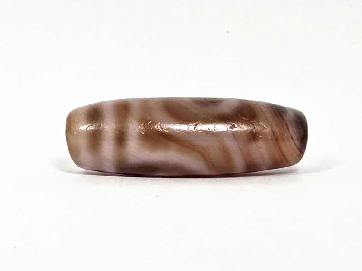 At-080426-2EBS antique two eye dzi bead 38.0×13.1mm, turn view opposite showing full banding character and body profile, unretouched