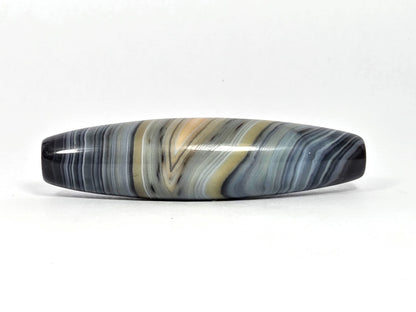 Naturally-formed one eye dzi bead, blue-grey and gold banded agate with striped patterns, polished surface