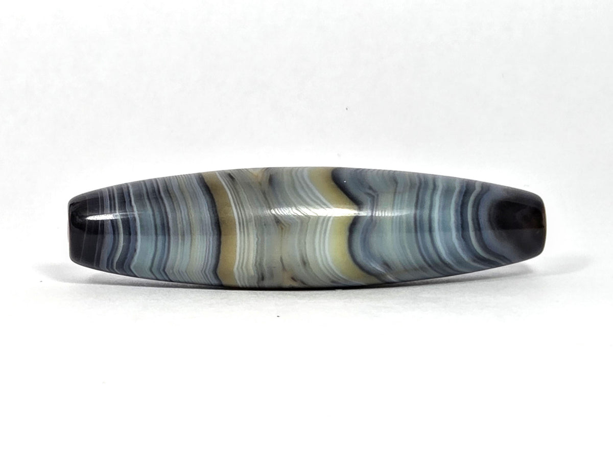 Natural one-eye dzi bead, blue-grey and gold banded agate with wavy striations, 59.3x15.2mm
