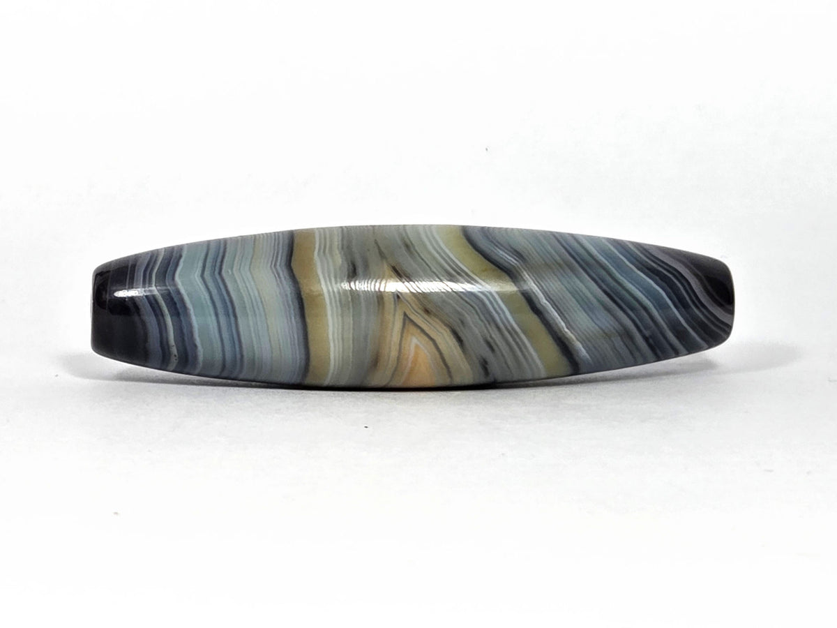 Naturally-formed one-eye dzi bead, blue-grey and gold banded agate, polished surface, 59.3×15.2mm