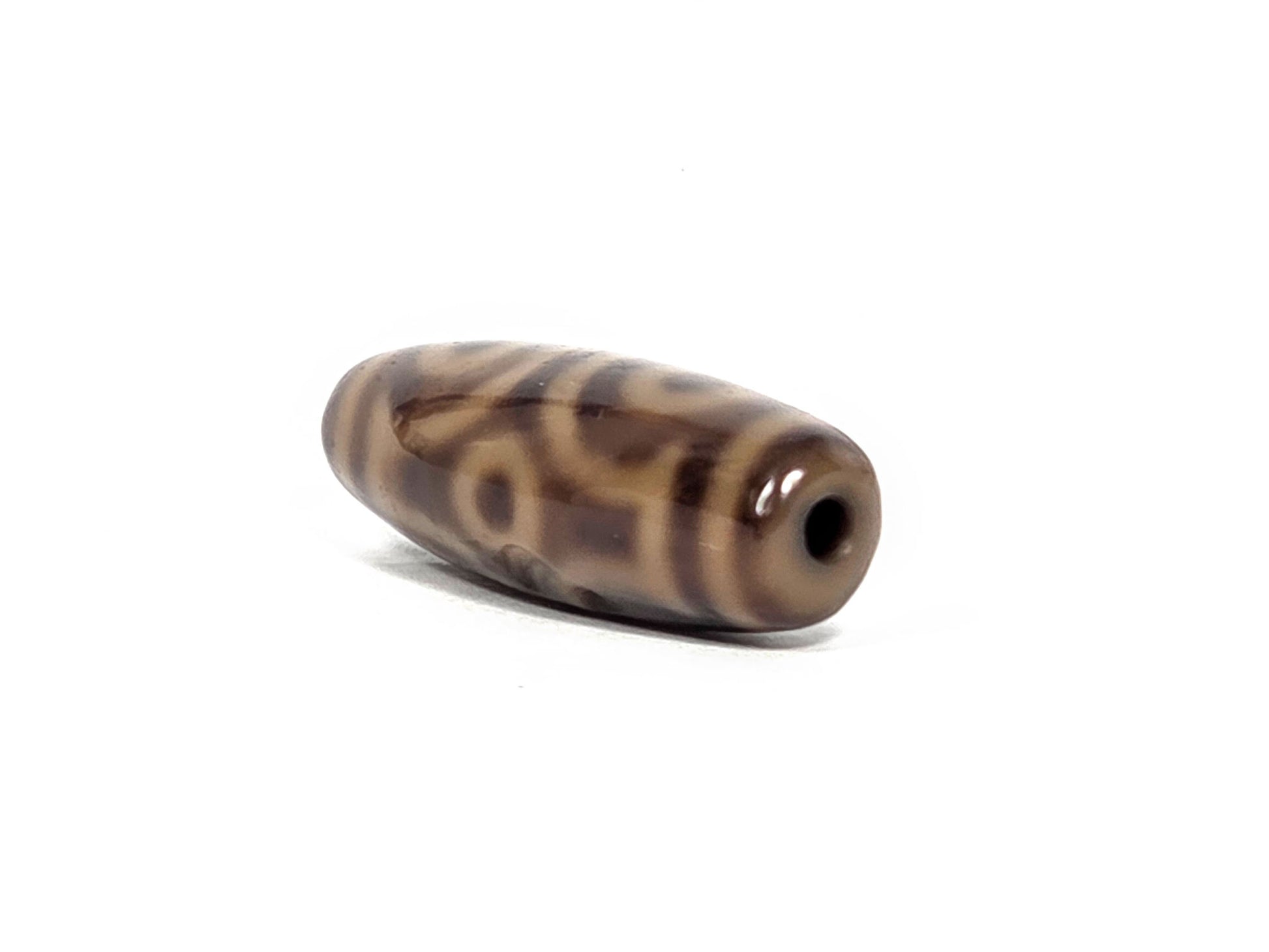 At-082326-6EMD antique six eye dzi bead drill end view one agate fusiform barrel unretouched