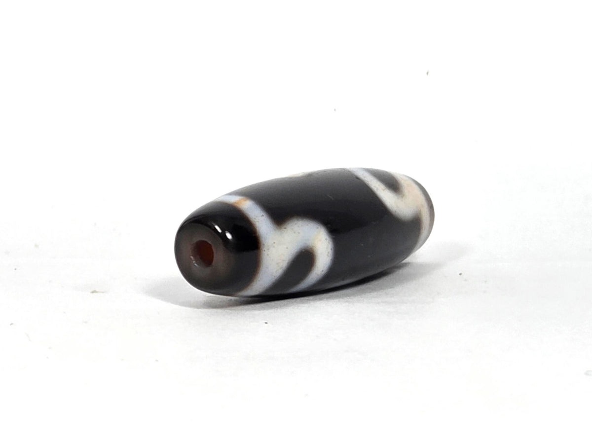 At-090526-RYBS antique ruyi dzi black agate angled opposite drill end warm reddish-brown cap, unretouched