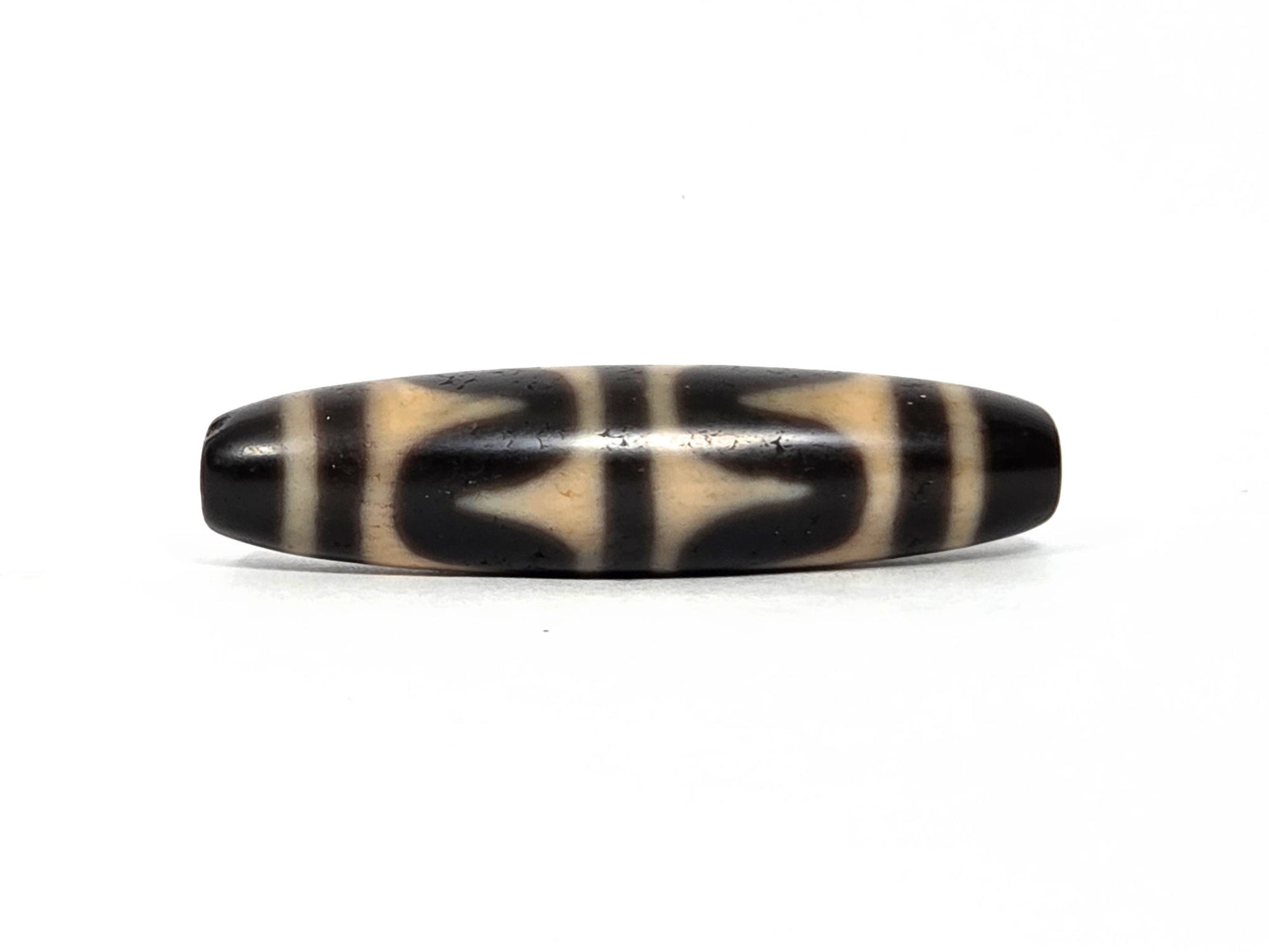 At-090226-DW7 antique double wave dzi black agate face B wave composition drill ends visible, unretouched