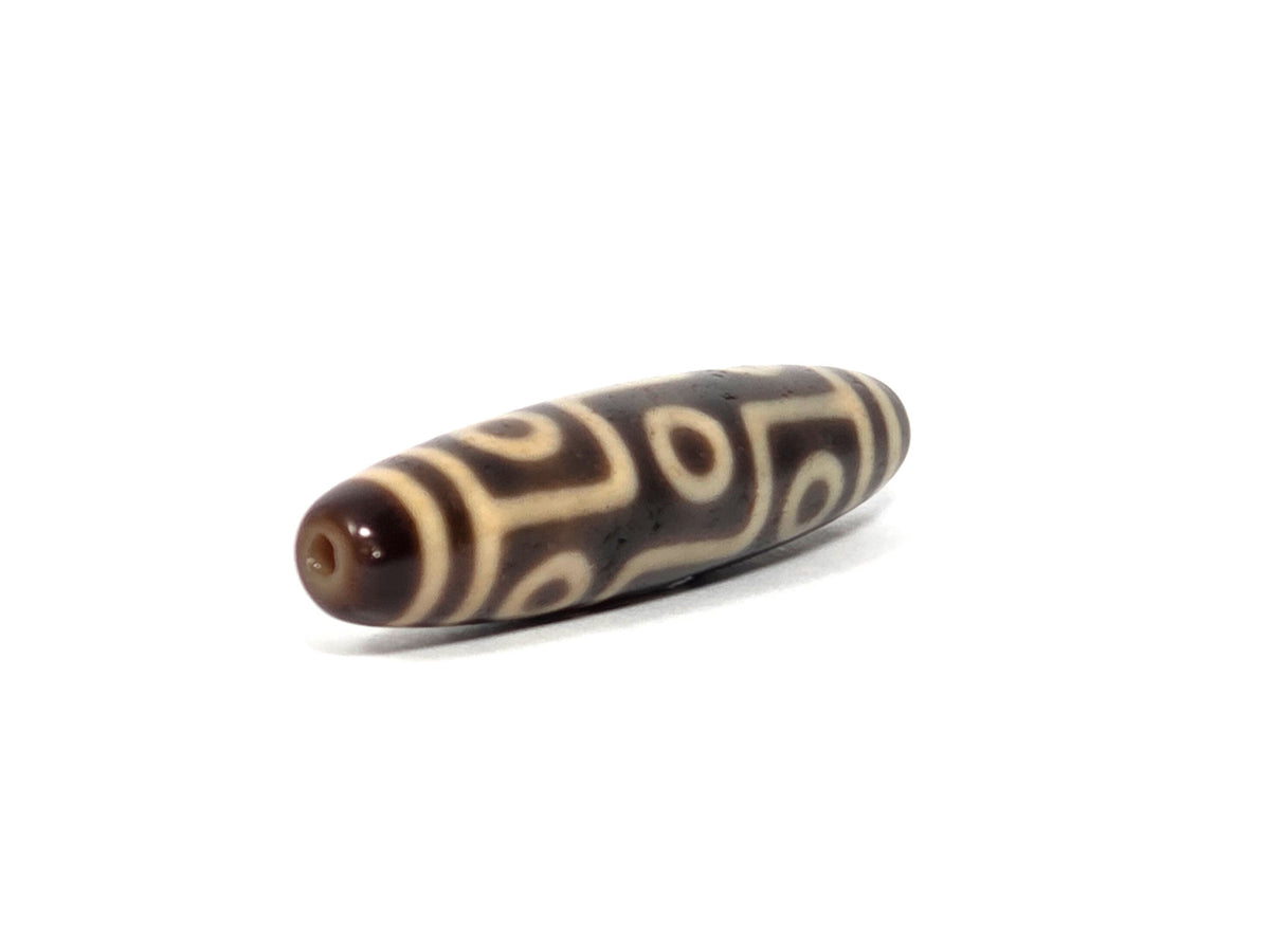 At-090326-9E antique nine eye dzi dark brown agate angled drill end warm brown cap, unretouched