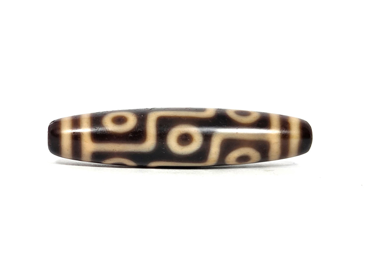 At-091626-9E antique Tibetan nine eye dzi dark brown agate face A second angle stacked eye rows cream lines unretouched