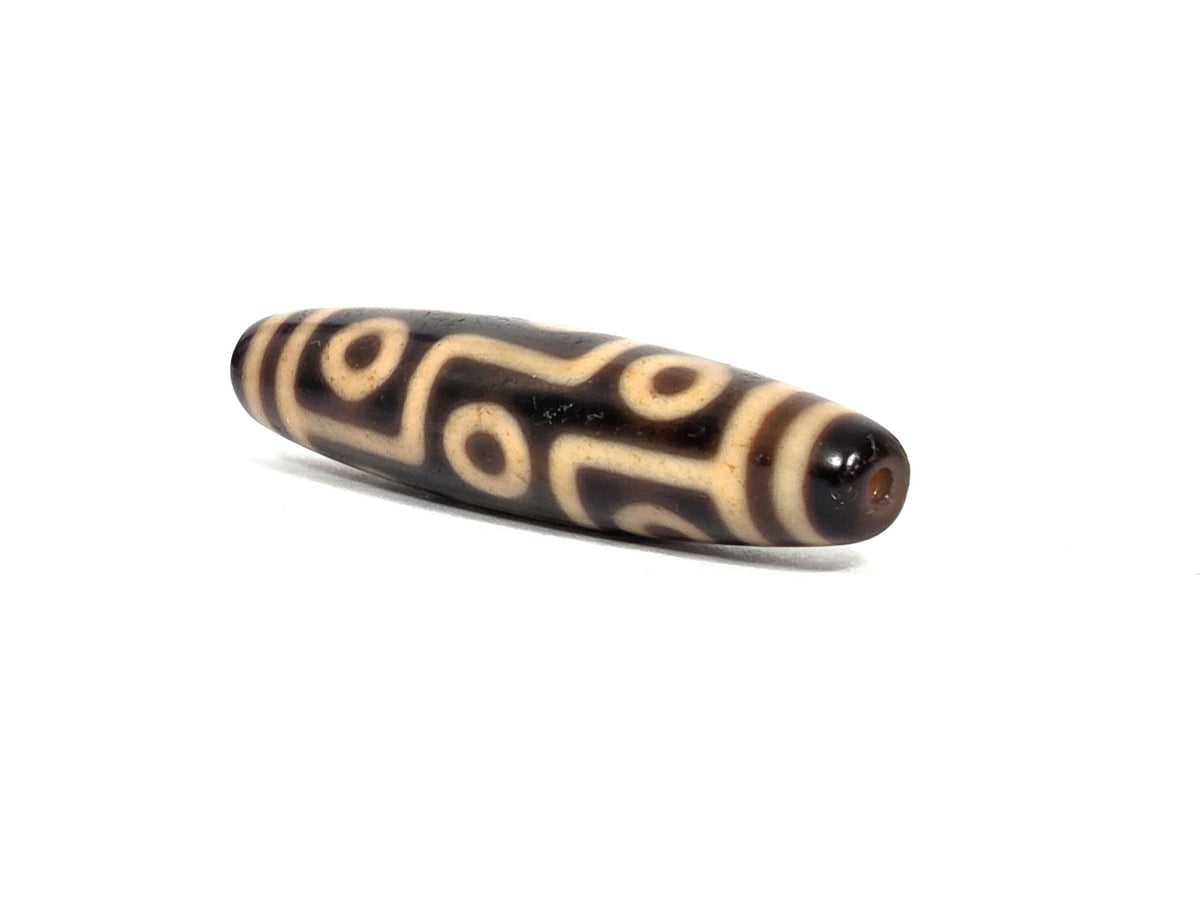 At-091626-9E antique Tibetan nine eye dzi angled drill end A dark brown agate clean hole unretouched