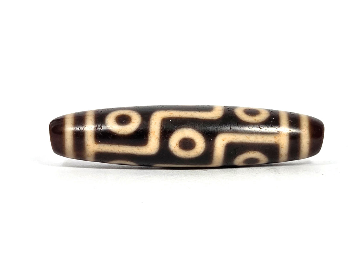 At-091626-9E2 antique nine eye dzi dark brown agate face A second angle bright cream motif lines unretouched