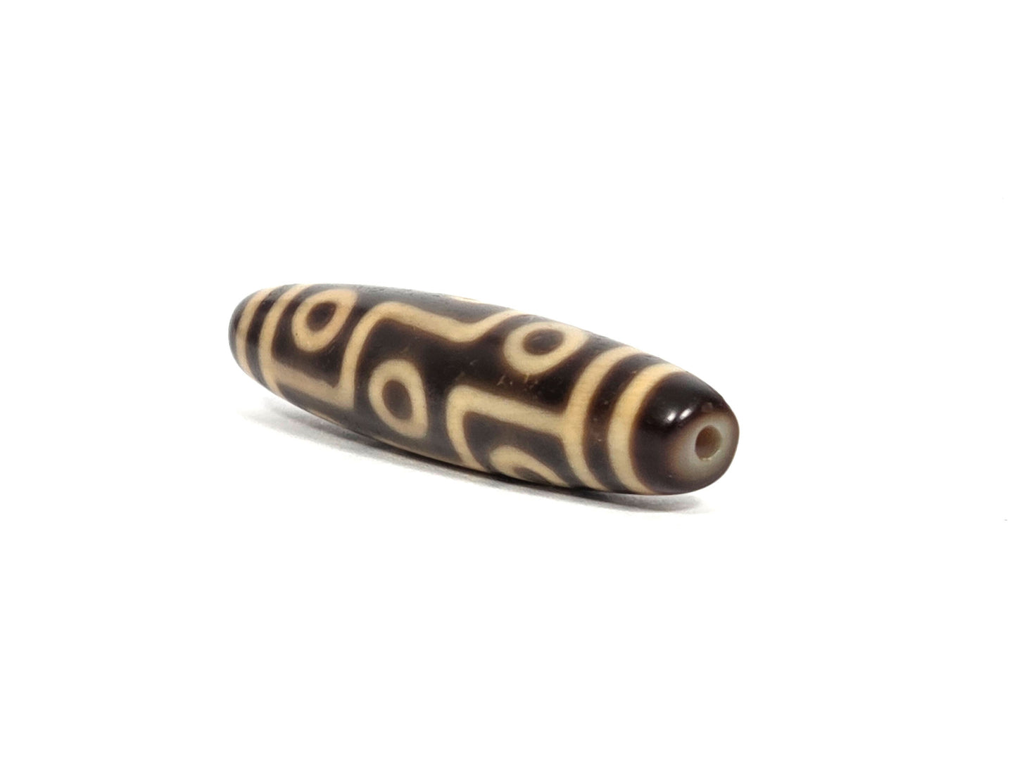 At-090326-9E2 antique nine eye dzi dark brown cream agate angled drill end warm brown cap, unretouched