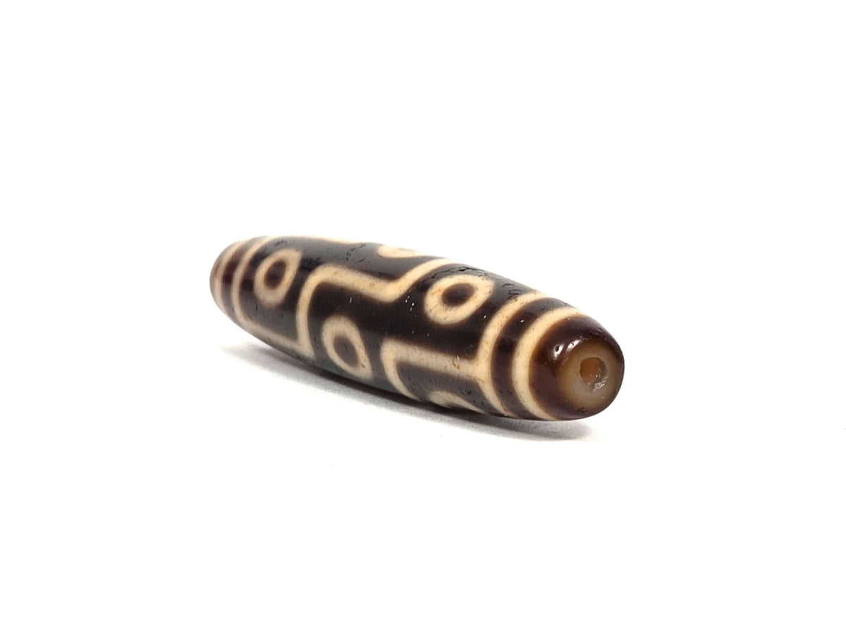 At-091626-9E2 antique nine eye dzi angled drill end B clean drill hole dark brown agate unretouched