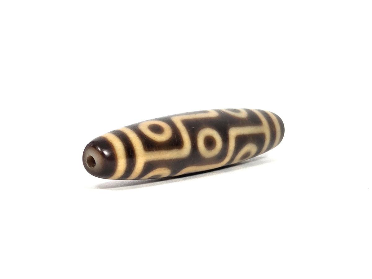At-090326-9E2 antique nine eye dzi dark brown cream agate angled opposite drill end grid detail, unretouched