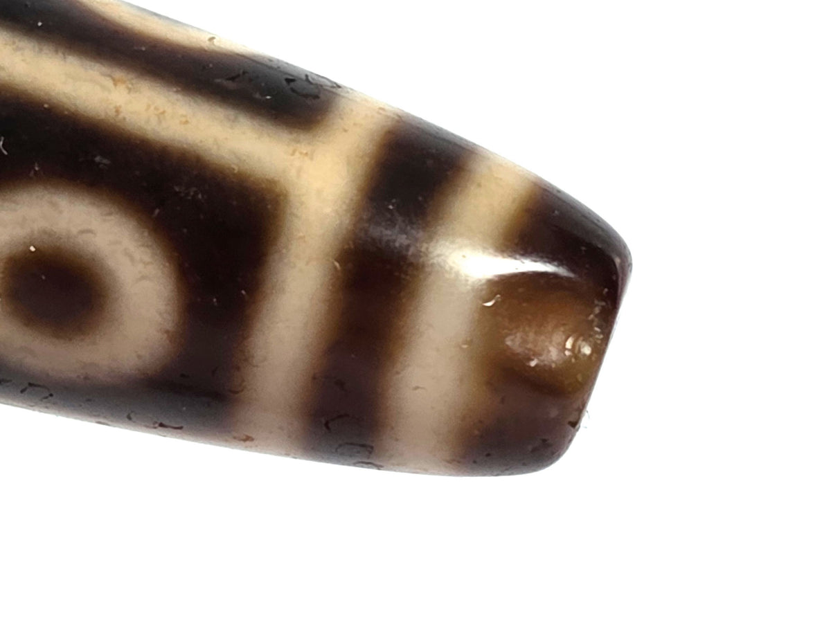 At-091626-9E2 antique nine eye dzi macro medicine dig end warm honey protrusion end cap zone unretouched