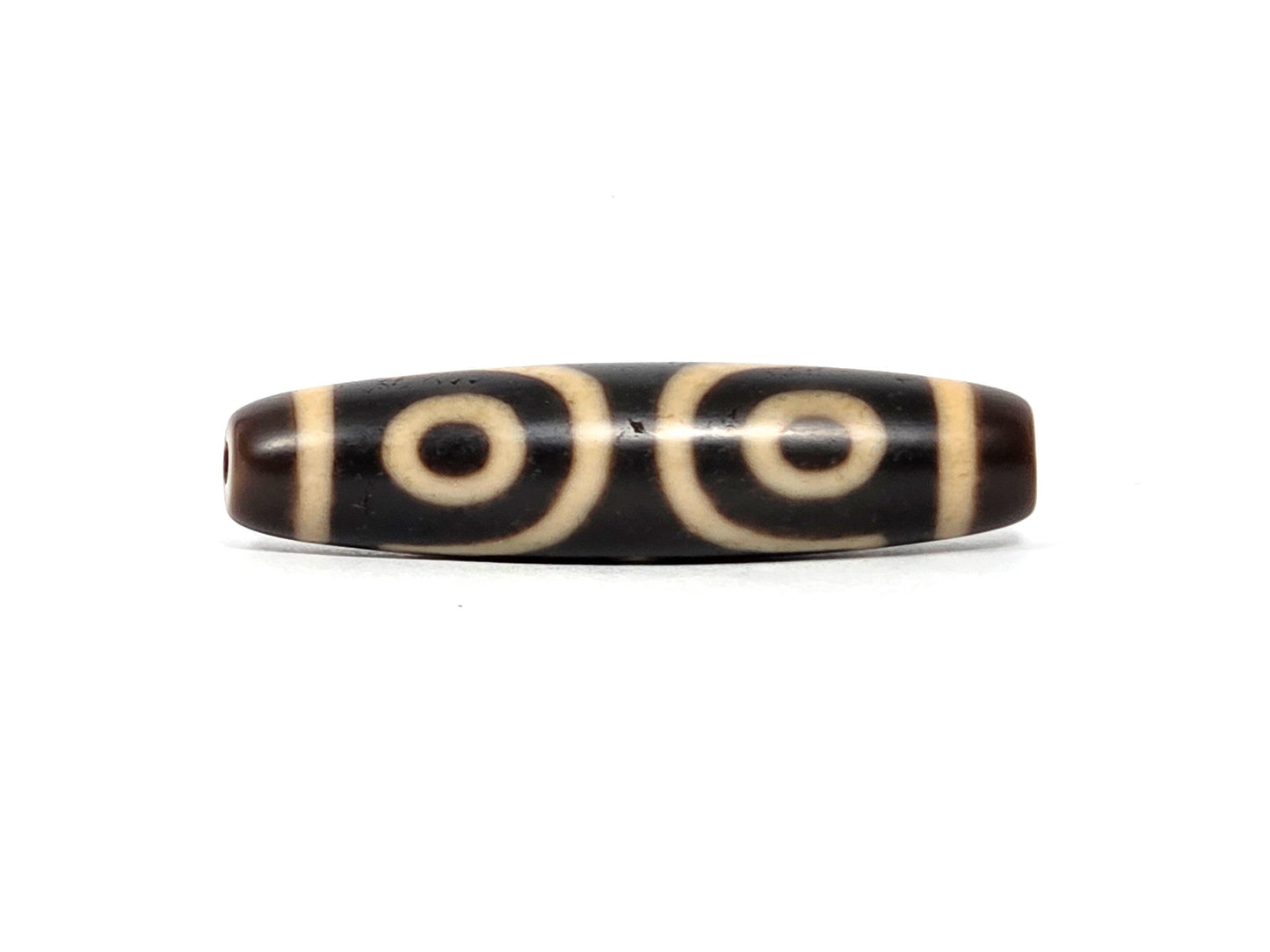 At-090226-3E2 antique three eye dzi dark agate face B two eyes side by side drill end visible, unretouched