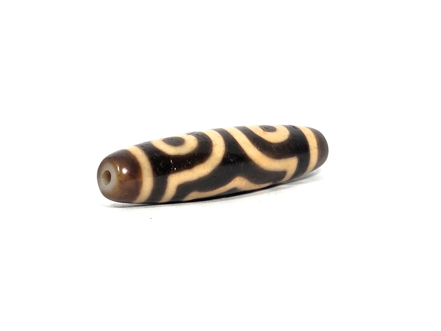 At-090226-3E3 antique three eye dzi dark brown black agate angled opposite drill end two eyes visible, unretouched