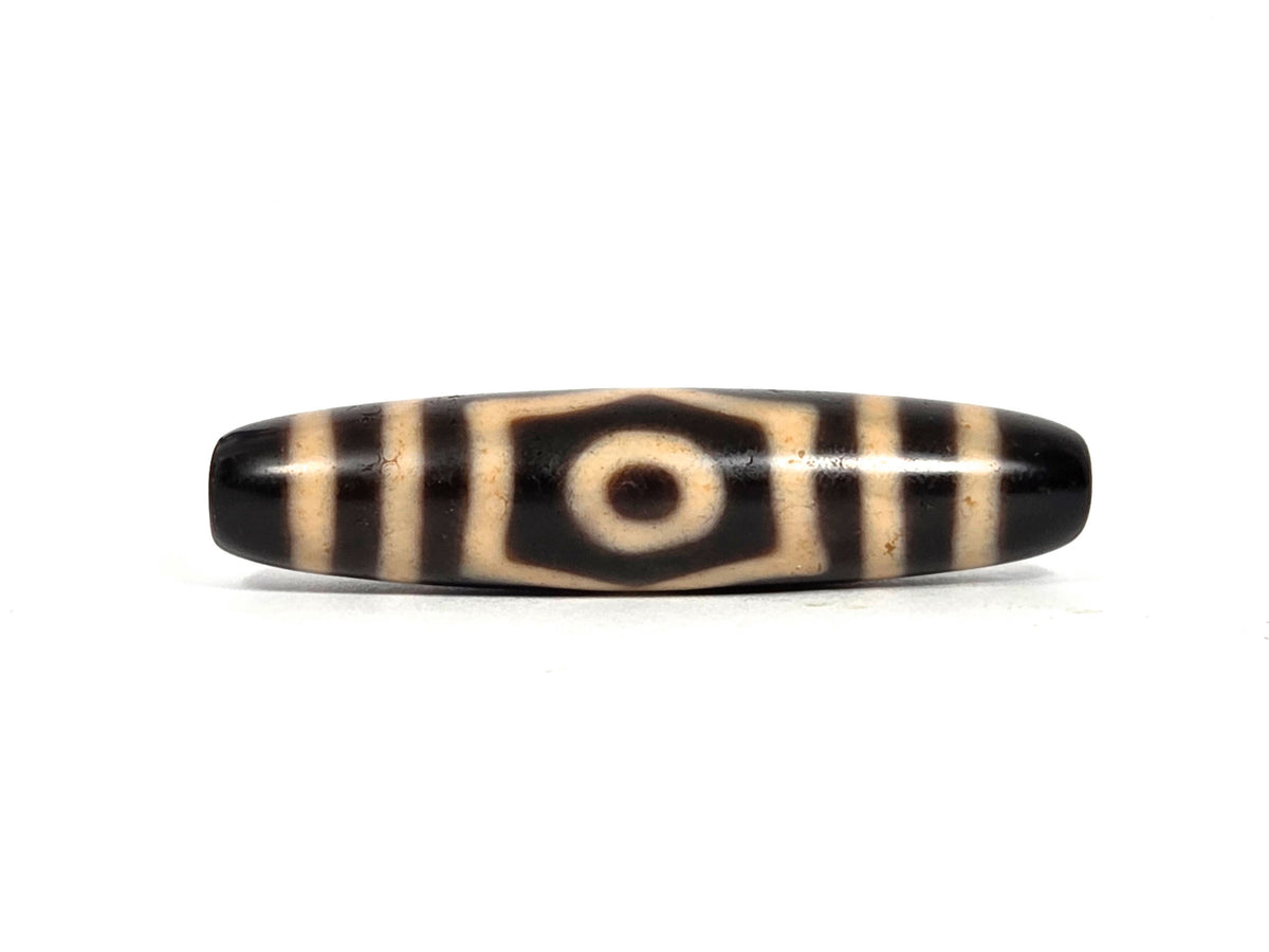 At-090626-3E5 antique three eye dzi 50.7×11.8mm black agate face A single eye hexagonal cream surround, unretouched