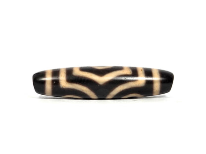 Three Eye Motif black agate dzi bead with cream striped pattern and polished surface