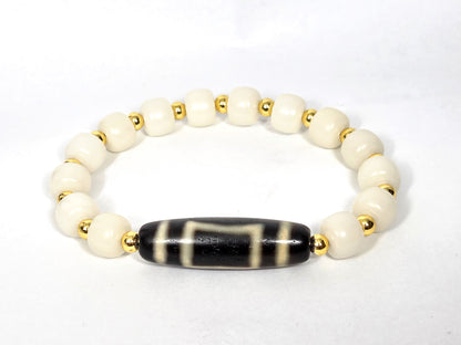 Heaven & Earth dzi bracelet with black striped agate barrel bead and white bodhi root beads with gold spacers