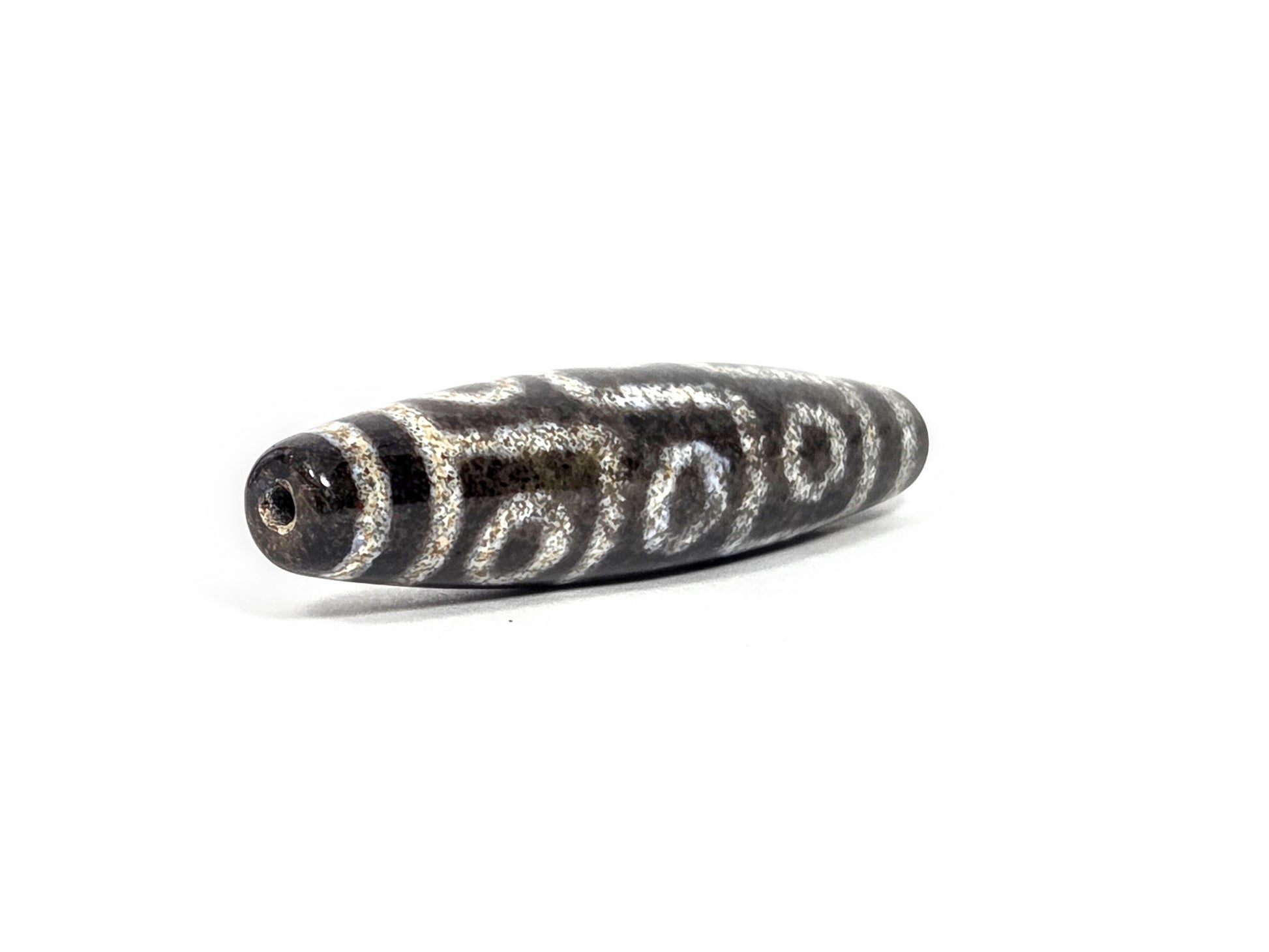 N-082326-9EBS new nine eye dzi bead drill end view two fusiform taper pitch-black agate unretouched