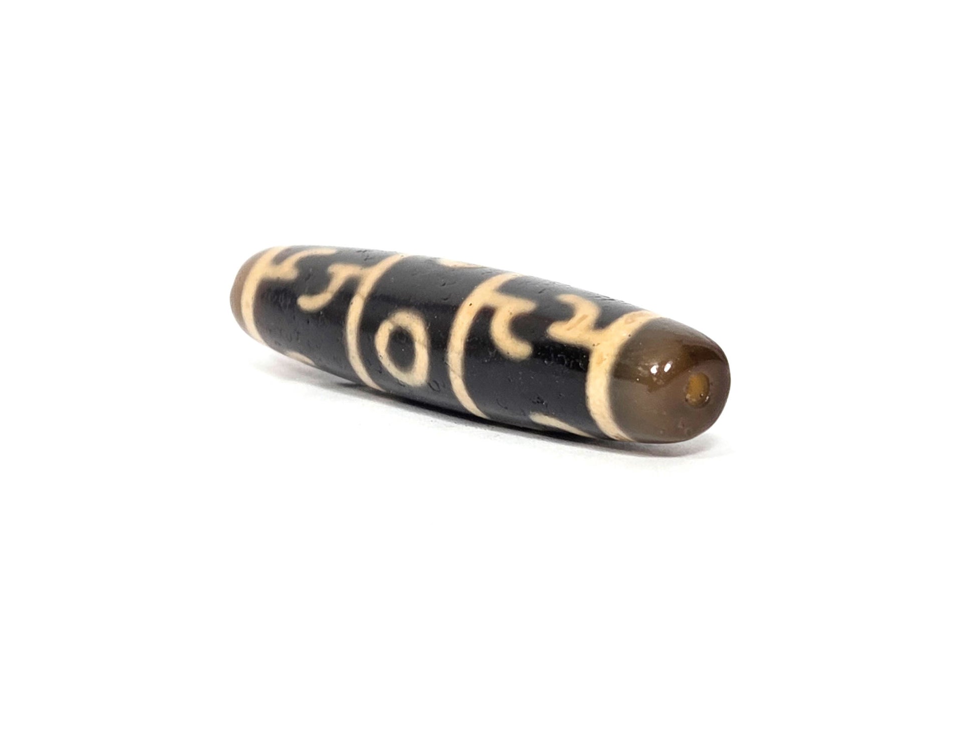 N-090526-3EGRP new Guru Rinpoche three eye dzi 58.6×12.9mm black agate angled opposite drill end, unretouched