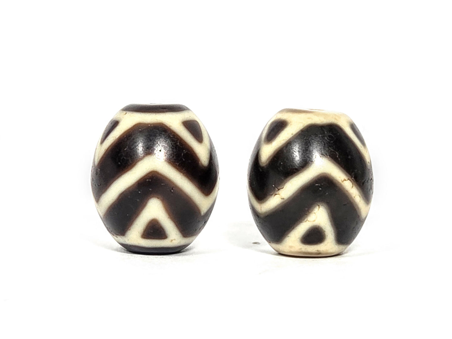 At-070626-TTW hero pair front, tiger tooth & wave dzi, 18.2×15.8mm & 17.9×15.7mm, very dark brown agate, cream motif, unretouched