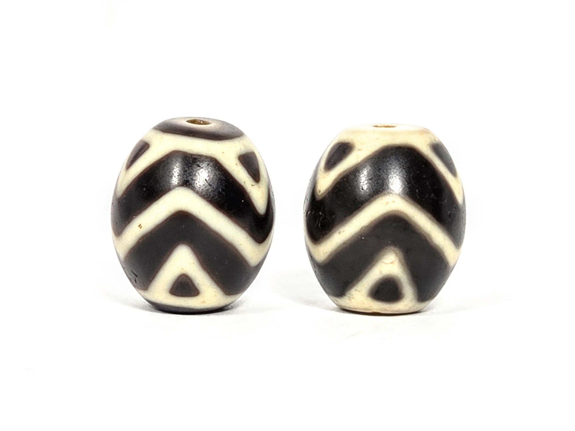 At-070626-TTW pair rotated face 2, tiger tooth wave dzi, cream-white chevron motif, very dark brown ground, unretouched