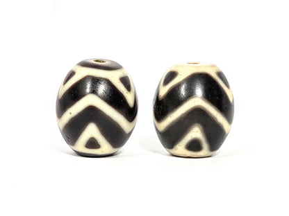 At-070626-TTW pair rotated face 2, tiger tooth wave dzi, cream-white chevron motif, very dark brown ground, unretouched