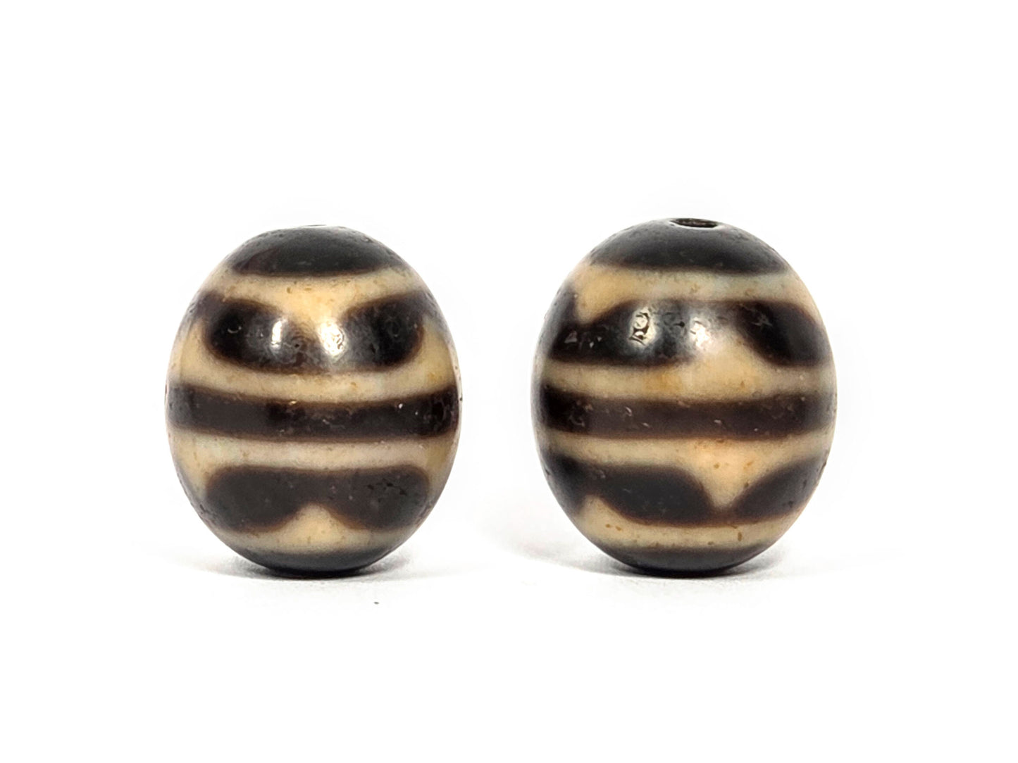 V-071426-DWP3 Double Wave pair face C — warm honey-cream waves Bead B, deeper dark Bead A, 1980s Taiwan, unretouched. 