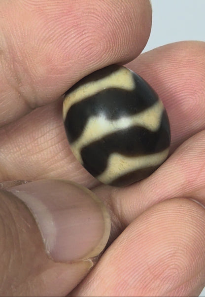 Antique Tibetan Round Dzi Bead featuring Double Wave Motif (110325)