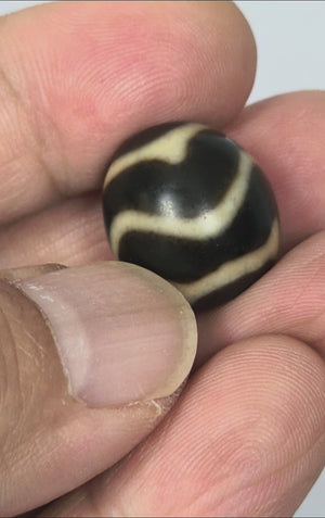 Antique Tibetan Round Dzi Bead featuring Wave & Tiger Tooth Motif (111325)